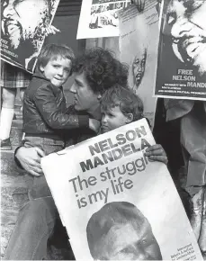  ?? Picture: Arena Group archive ?? Peter Hain as an anti-apartheid activist with his sons, Sam and Jake, in London in the 1970s.