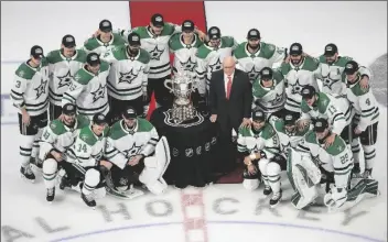  ?? ASSOCIATED PRESS ?? MEMBERS OF THE DALLAS STARS POSE WITH the Clarence Campbell Bowl, awarded to the NHL’s Western Conference champions, after defeating the Vegas Golden Knights in overtime NHL Western Conference final playoff game action in Edmonton, Alberta, Monday.