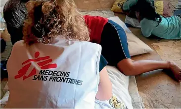  ?? AP ?? A patient is attended by a Medecins Sans Frontieres mental health team in Nauru. Humanitari­an medical profession­als were expelled from Nauru last week, abruptly ending their free medical care for asylum seekers and local Nauruans.