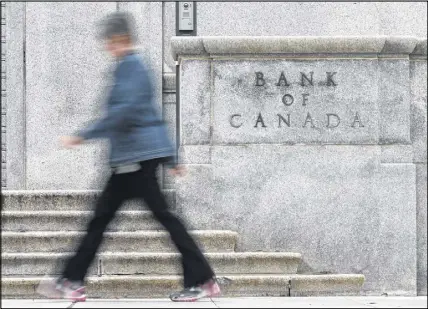  ?? CP PHOTO ?? The Bank of Canada is defending itself amid questions about its public silence ahead of an interest-rate hike last week that caught many analysts by surprise.