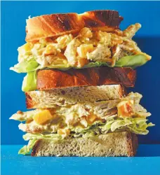  ?? WASHINGTON POST PHOTOS ?? Bring style to weekday, brown bag lunches with the Sriracha Mayo BLT, top right, a crunchy Raspberry PB&J, middle right, a spicy, smoky turkey sandwich, right, a double mango curry chicken salad sandwich, above, or a dill and pickle egg salad sandwich.