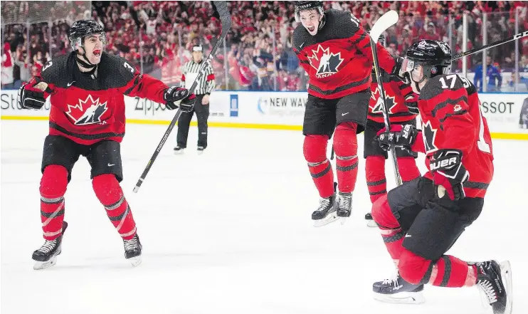 ?? — CP PHOTO ?? Tyler Steenberge­n, right, celebrates his game-winning goal against Sweden to help Canada claim the world juniors gold medal Friday night in Buffalo.
