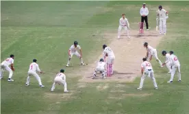  ?? Photograph: David Gray/AFP/Getty Images ?? England's James Anderson plays a shot on the final delivery of the Sydney Test while surrounded by Australia fielders.