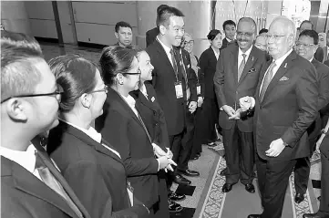  ??  ?? Najib (right) having a light moment with the participan­ts at the event as Chief Secretary to the Government Tan Sri Dr Ali Hamsa (second right) looks on. — Bernama photo