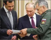  ?? MIKHAIL KLIMENTYEV / KREMLIN POOL PHOTO VIA AP ?? Syrian President Bashar Assad (left) meets with Russian President Vladimir Putin and Defense Minister Sergei Shoigu on Monday ahead of a summit with Russia, Turkey and Iran in Sochi, Russia.