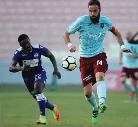  ??  ?? Gzira's Spanish captain Moises Avila Perez drives forward his side against St. Andrews