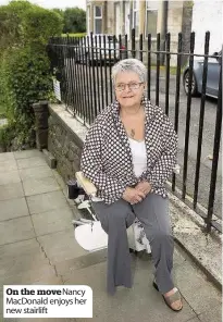  ??  ?? On the move Nancy MacDonald enjoys her new stairlift