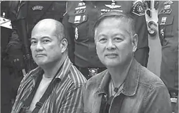  ?? ASSOCIATED PRESS FILE ?? Former Palawan governor Joel Reyes (right), former mayor Mario Reyes Jr. of Coron, Palawan.