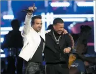 ?? THE ASSOCIATED PRESS ?? Luis Fonsi, left, and Daddy Yankee perform “Despacito” at the 60th annual Grammy Awards.