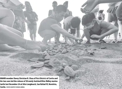  ?? PHOTO COURTESY DENNIS ABRINA ?? BOARD member Davey Christian R. Chua of First District of Cavite and his two sons led the release of 58 newly- hatched Olive Ridley marine turtle last December 24 at Sitio Longbeach, San Rafael IV, Noveleta, Cavite.