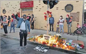  ?? Ted Shaffrey Associated Press ?? THE ROCHESTER, N.Y., site where police held Daniel “Rell” Prude down until he stopped moving is now marked by a memorial. His death received little attention this spring amid the state’s COVID-19 crisis.