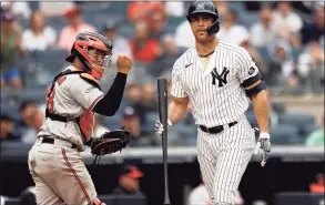  ?? Adam Hunger / Associated Press ?? The Yankees’ Giancarlo Stanton, right, reacts to striking out during the fifth inning against the Orioles on Sunday.