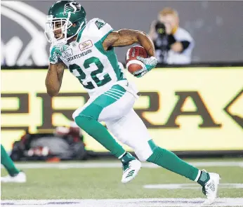  ?? PHOTOS: MARK BLINCH/THE CANADIAN PRESS ?? The Saskatchew­an Roughrider­s’ Christion Jones takes off on a 61-yard punt-return touchdown Thursday against the Hamilton Tiger-Cats.