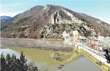  ??  ?? File photo shows, more than 5,000 cubic metres of waste and debris are seen at the dam of ‘Visegrad’ water power plant, on river Drina, near Eastern-Bosnian town of Visegrad.