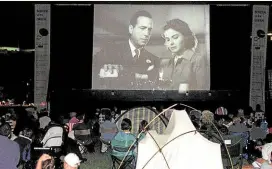  ?? ?? TIMELESS Moviegoers watch “Casablanca” on an outdoor screen in Washington on July 12, 1999.