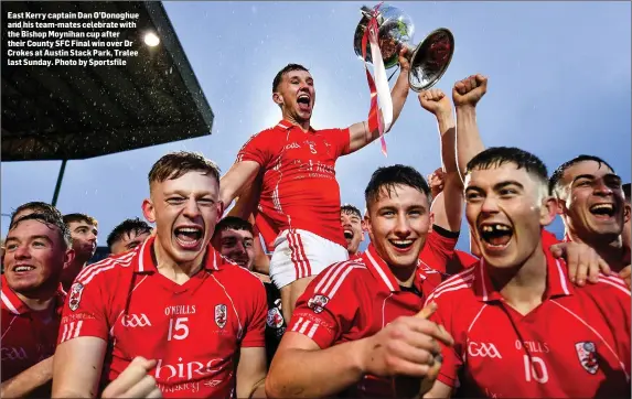  ??  ?? East Kerry captain Dan O’Donoghue and his team-mates celebrate with the Bishop Moynihan cup after their County SFC Final win over Dr Crokes at Austin Stack Park, Tralee last Sunday. Photo by Sportsfile