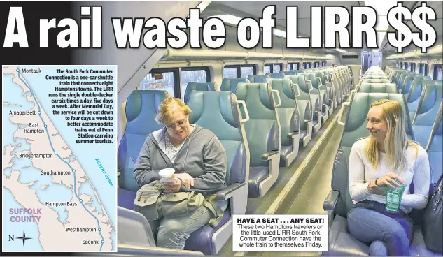  ??  ?? HAVE A SEAT . . . ANY SEAT! These two Hamptons travelers on the little-used LIRR South Fork Commuter Connection have the whole train to themselves Friday.