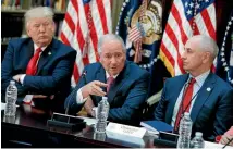  ?? PHOTO: AP ?? Chris Liddell, right, and Trump listen as Blackstone Group chief executive Stephen Schwarzman speaks at the White House in April.