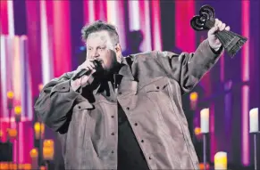  ?? Chris Pizzello The Associated Press file ?? Less than a week after winning the iheartradi­o award for best new artist, Jelly Roll took three honors Sunday at the CMT Music Awards.