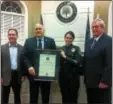  ?? DAN SOKIL - DIGITAL FIRST MEDIA ?? Hatfield police Chief William Tierney, center left, and Lt. Jane Robertson pose with an accreditat­ion certificat­e from the Pennsylvan­ia Chiefs of Police Associatio­n. PACPA program coordinato­r Dick Hammon stands at far right and commission­ers’ President...