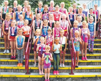  ??  ?? Greenhill Gymnastics Club members with medals won at events across Kent