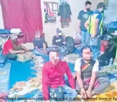  ??  ?? The illegal immigrants caught during a raid at an unnumbered house in Kg Kurnia Jaya on Monday.