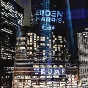  ?? COURTESY OF TWITTER USER @USWBAT ?? A spotlight shines the words “Biden-Harris” onto Trump Tower late Friday.