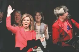  ?? AP PHOTO/MARK HUMPHREY ?? U.S. Rep. Marsha Blackburn, R-Tenn., sings along with John Rich, right, after addressing supporters in Franklin, Tenn., after she was declared the winner over former Gov. Phil Bredesen in their race for the U.S. Senate.