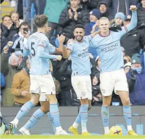  ?? (Photos: AP) ?? Manchester City’s Erling Haaland (right) celebrates after scoring his side’s third goal during their English Premier League match against Wolverhamp­ton Wanderers at the Etihad Stadium in Manchester, England, on Sunday.