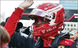  ?? HAMAD MOHAMMED — POOL VIA AP ?? Ferrari driver Charles Leclerc of Monaco celebrates after setting the pole position in the qualifying session Saturday at the Baku circuit, in Baku, Azerbaijan.