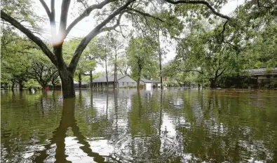  ?? Jon Shapley / Houston Chronicle file ?? On April 18, 2016, this area was flooded along Runnymeade Drive in the Meyerland neighborho­od.