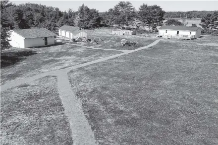  ?? Dan Peacock ?? This bird’s-eye view of Camp Jordan shows the new gravel pathways and wheelchair-accessible ramps that were added to camp buildings.