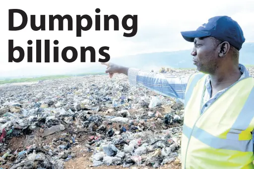  ?? FILE ?? NSWMA Executive Director Audley Gordon points to a section of the Riverton City landfill after a fire was put out on the dump in this June 2017 file photo.