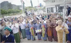  ?? — AFP ?? People cheering during the opening ceremony for the election winning signboard at the Union Solidarity and Developmen­t Party offices in Taung Gyi, Shan State in Myanmar, on Tuesday.