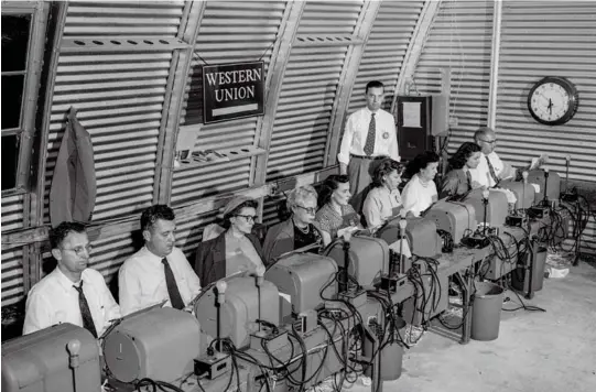  ??  ?? before the internet Western Union workers at the Quonset hut in 1954, three years after Jenkins' first Masters.