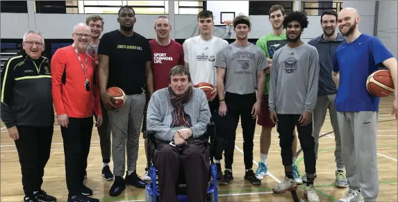  ??  ?? Garvey’s Tralee Warriors new signing Andre Berry with his new team mates, team coach Pat Price and Warriors club officer Terry O’Brien