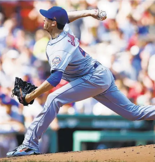  ??  ?? Jacob deGrom again fails to pick up victory, but he does give up a few runs this time against Red Sox at Fenway. AP