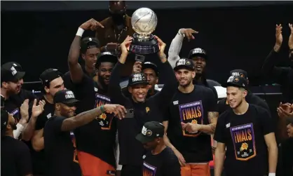  ??  ?? Head coach Monty Williams of the Phoenix Suns holds the Western Conference championsh­ip trophy after the Suns defeated the Clippers in Wednesday’s Game 6. Photograph: Ronald Martinez/Getty Images