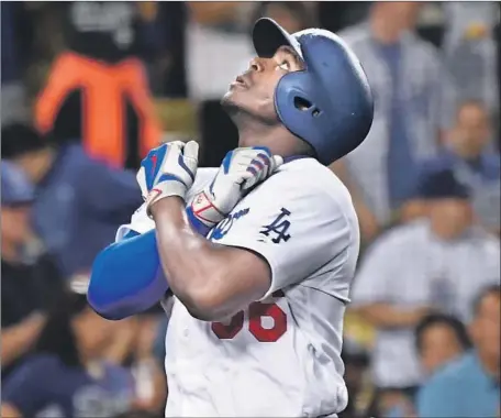  ?? Wally Skalij Los Angeles Times ?? YASIEL PUIG CELEBRATES after his two-run home run gave the Dodgers a 6-2 lead and jump-started a seven-run fourth inning.