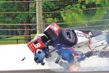  ?? AP ?? The car driven by Sebastien Bourdais, of France, crashes into the wall in the second turn during qualificat­ions for the Indianapol­is 500 IndyCar race at Indianapol­is Motor Speedway on Saturday.