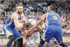  ?? —USA Today Sports ?? San Antonio Spurs shooting guard Manu Ginobili (20) battles with Golden State Warriors center JaVale McGee (1) and Andre Iguodala (9) during the first half in game four of the Western conference finals of the NBA Playoffs at AT&T Center.