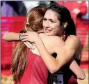  ?? NWA Democrat-Gazette/DAVID GOTTSCHALK ?? Arkansas’ Taylor Werner is congratula­ted by a teammate after winning Friday’s NCAA South Central Regional cross country meet. The Razorbacks swept the top five positions.