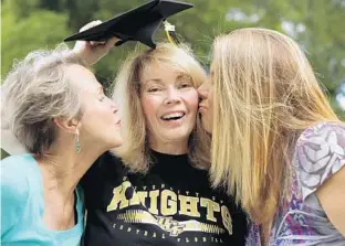  ?? RICARDO RAMIREZ BUXEDA/STAFF PHOTOGRAPH­ER ?? Just weeks after being diagnosed with terminal cancer, Cherie Carr, 63, middle, will graduate today from UCF. She’s found support from her sister, Vicki Snell, right, and praise from UCF instructor Stephanie Rice.