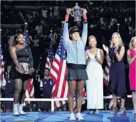  ?? PHOTO: USA TODAY ?? The champion . . . Naomi Osaka, of Japan, holds the US Open trophy after beating Serena Williams, of the US, in the women’s final of the US Open yesterday.