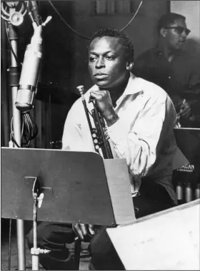  ?? (TNS) ?? pmartin@adgnewsroo­m.com blooddirta­ngels.com Jazz trumpeter and composer Miles Davis sits with his instrument during a studio recording session in October 1959.