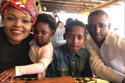  ?? PICTURE: SUPPLIED ?? Asanda Mpumlwana, 32, with her daughter Boitumelo, 2, and son Buhle,11, and her husband Thabo Masoko. Mpumlwana says she never focused much on the notion of lobolo before she met Masoko.