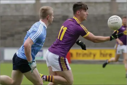  ??  ?? Mikie Dwyer on the move for Wexford as Dublin’s Eoin O’Dea tries to close off his run.