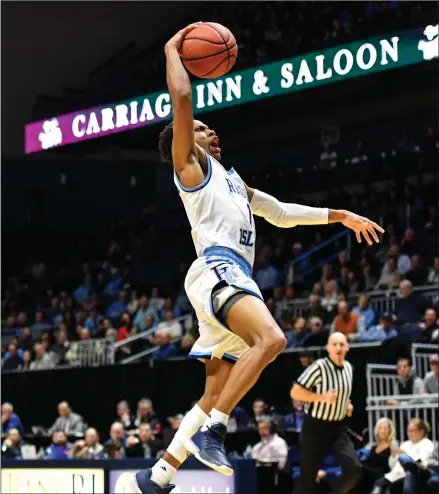  ?? Photo by Jerry Silberman / risportsph­oto.com ?? Rhode Island guard Fatts Russell (1) soars to the hoop during the first half of the Rams’ 72-52 victory over rival Brown Wednesday night at the Ryan Center. The Rams are now 2-0 against Ocean State foes headed into Saturday’s showdown with Providence at The Dunk.