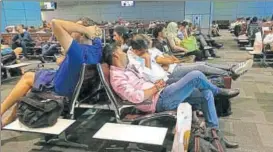  ?? AP ?? Passengers of cancelled flights wait in Hamad Internatio­nal Airport in Doha on Tuesday.