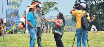  ?? Photo: Tisha Steyn ?? Roche Schoeman (grey shirt) of Fearless Adventures during an interview with SABC2 at the Adventure Tourism Expo at the Map of Africa in October. Fearless Adventures is one of the companies that Alewijn Dippenaar and Niel Els will be representi­ng at the IBTM in Barcelona.